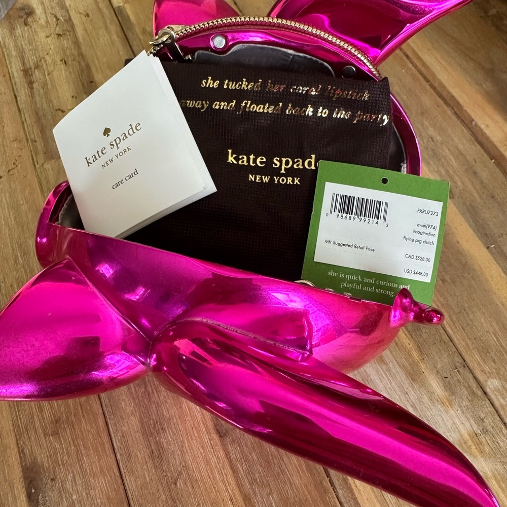 Kate Spade flying pig clutch she is quick and curious and playful and strong